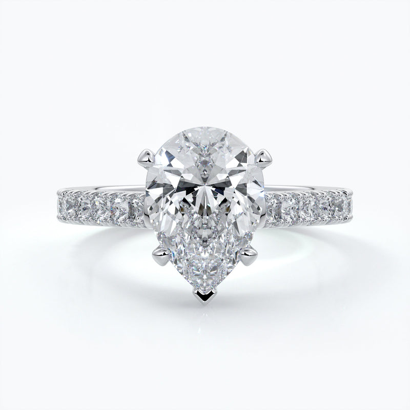 Platinum ring with pear-shaped diamond secured with four claws with shoulder diamond