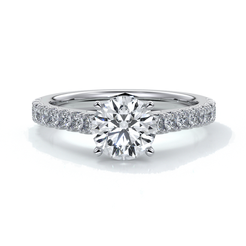 Platinum ring with round diamond secured with four claws with diamonds on the shoulders
