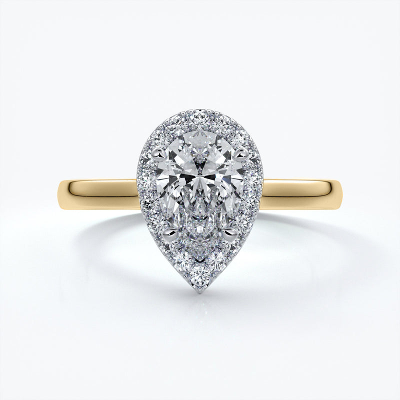 Gold ring with a one carat pear cut diamond in a cathedral halo setting with a slim comfort fit style band
