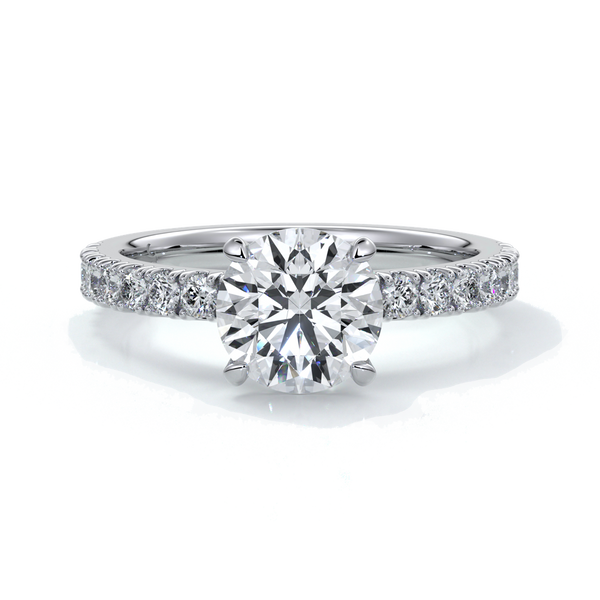 Platinum ring with round diamond and a scalloped diamond band