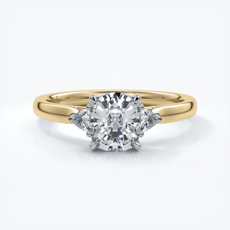 Gold diamond ring with four claws attaching diamond with two smaller diamonds on eachs side