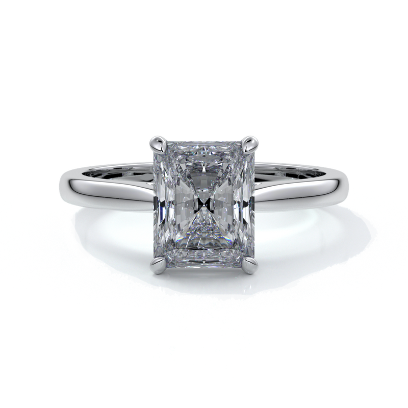 Ring with two carat radiant diamond held by four claws, enhanced with eighteen carat white gold tapered band