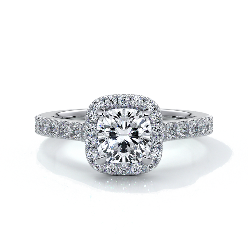 Platinum ring with one carat cushion cut diamond in a cathedral style setting with diamond detailing on the halo and shoulders