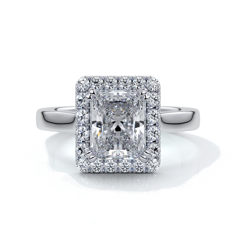 Platinum ring with a two carat radiant cut diamond with a cathedral and halo style setting