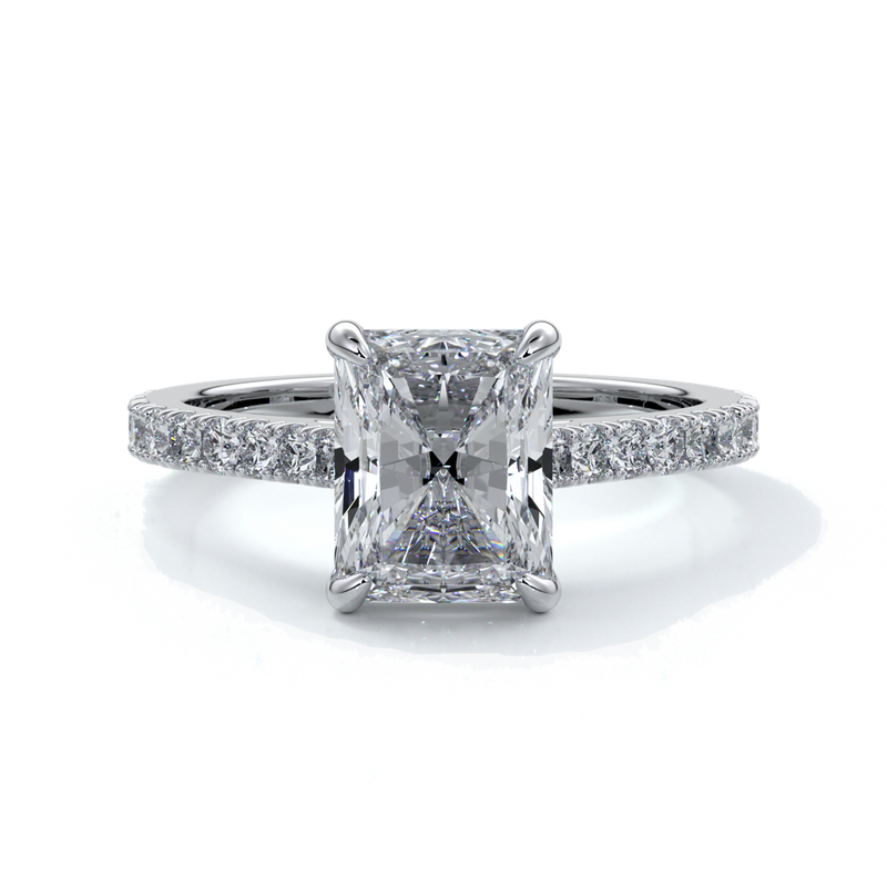 Platinum ring with a two carat radiant cut diamond enhanced in a cathedral setting with a scalloped diamond band