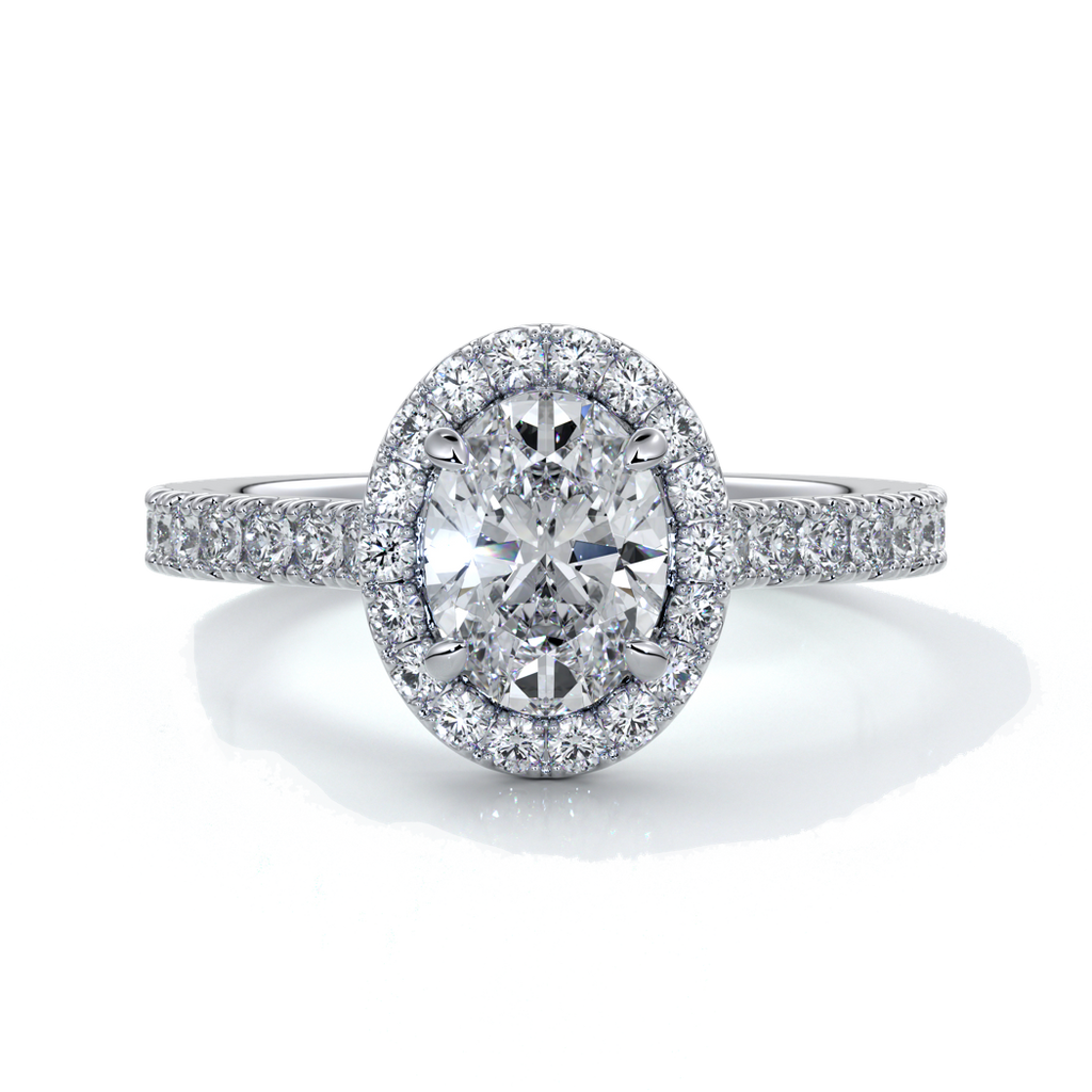 Platinum ring with one carat oval cut diamond in a cathedral style setting with scallop set shoulder diamonds and halo