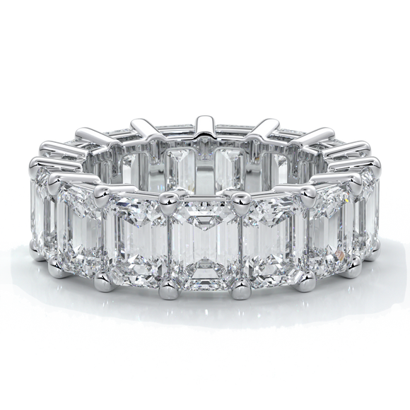 eighteen carat white gold women's wedding band with 5mm x 3.5mm Emerald cut diamonds in a scalloped setting