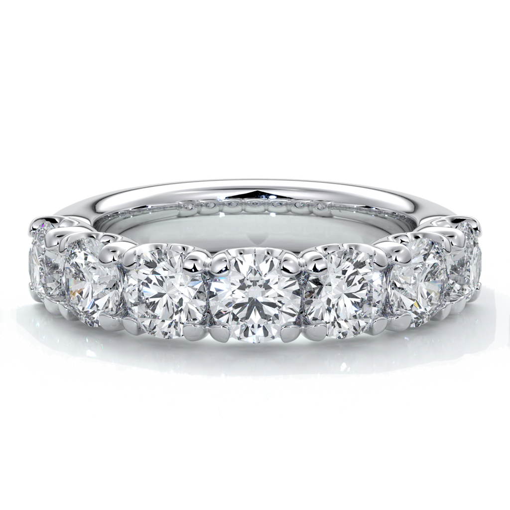 Platinum women's wedding band with 4mm round brilliant cut diamonds in a scalloped setting