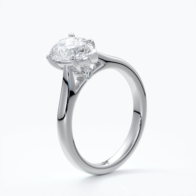 Silver ring with a pear-shaped diamond
