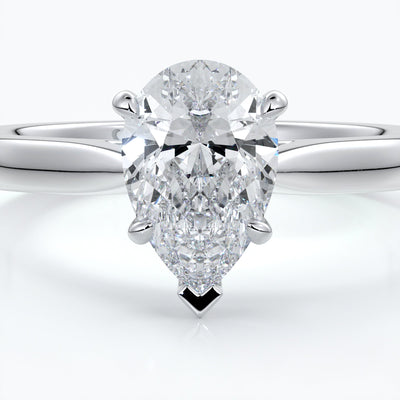 Silver ring with a pear-shaped diamond