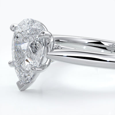 Silver ring with a pear-shaped diamond