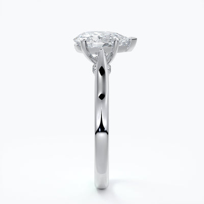 Silver ring with a pear-shaped diamond