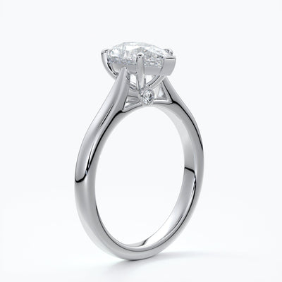 Silver ring with a pear-shaped diamond