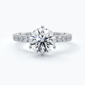 Diamond engagement ring with six claws and diamonds on each shoulder