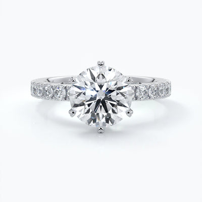 Diamond engagement ring with six claws and diamonds on each shoulder