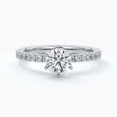Platinum diamond ring with diamonds on the shoulders