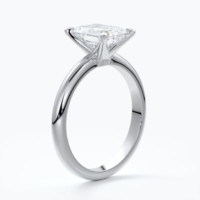 Platinum band with two carat emerald diamond secured with four claws