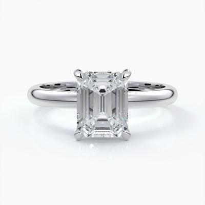 Platinum band with two carat emerald diamond secured with four claws