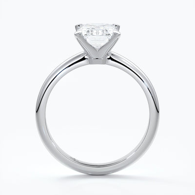 Platinum band with two carat emerald diamond secured with four claws