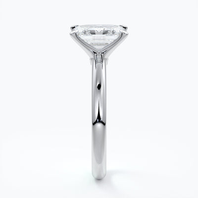 Platinum band with two carat emerald diamond secured with four claws