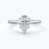 Ring with pear-shaped diamond on platinum band enhanced with a cathedral setting