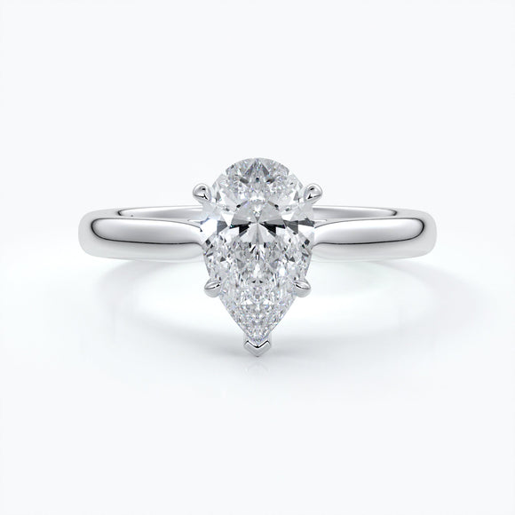 Ring with pear-shaped diamond on platinum band enhanced with a cathedral setting