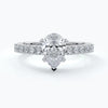 Platinum ring with a one carat pear diamond set in a solitaire platinum setting with diamond detailing on the shoulders