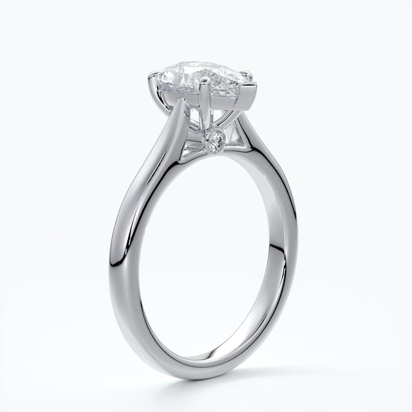 Platinum band with pear cut diamond secured with four claws