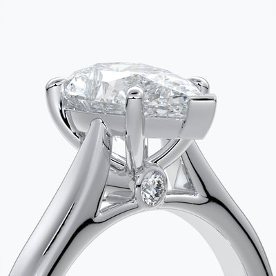 Platinum band with pear cut diamond secured with four claws