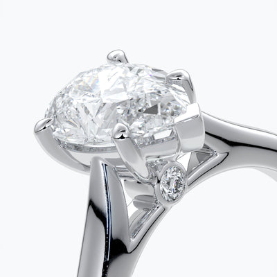 Platinum band with pear cut diamond secured with four claws