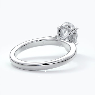Platinum band with pear cut diamond secured with four claws