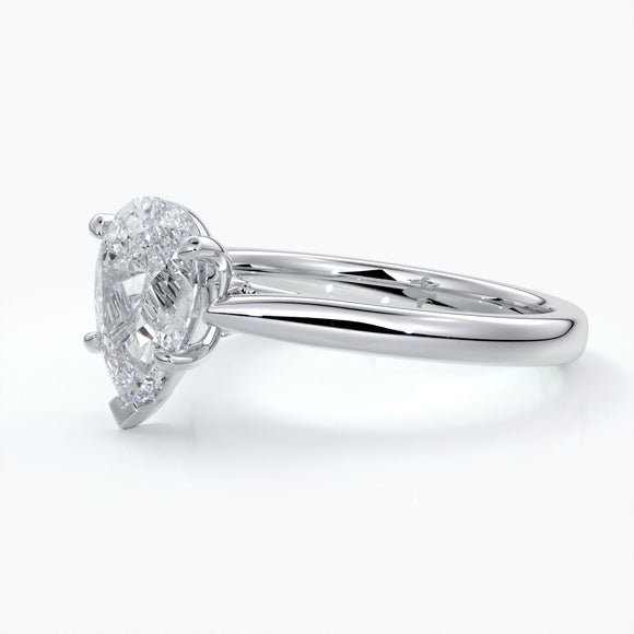 Platinum band with pear cut diamond secured with four claws