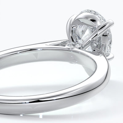 Platinum band with pear cut diamond secured with four claws