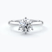 Platinum ring with two carat round diamond secured in six claws and enhanced with a Platinum band