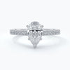 Pear diamond enhanced in a cathedral setting with shoulder diamonds on a platinum band