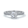 Platinum ring with round diamonds and diamonds on the band