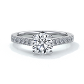 Platinum ring with round diamond secured with four claws with diamonds on the shoulders