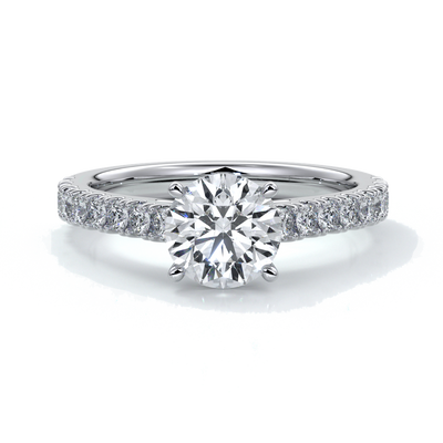 Platinum ring with round diamond secured with four claws with diamonds on the shoulders