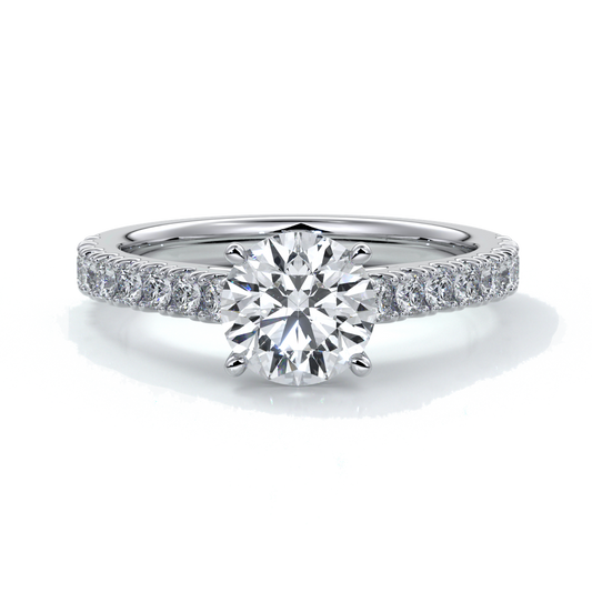 Platinum ring with round diamond secured with four claws with diamonds on the shoulders