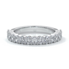 Platinum women's wedding band with 3mm x 2mm oval cut diamonds in a scalloped setting