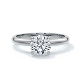 Platinum band with circle diamond secured by four claws