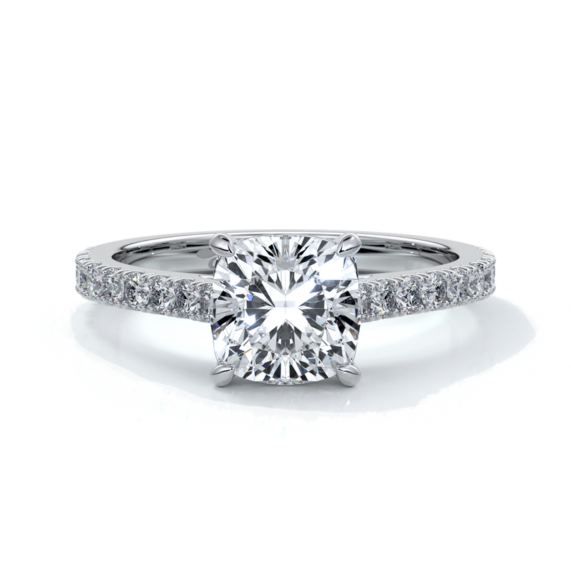 Platinum cathedral style band with a one and a half carat cushion cut diamond set in four claw platinum setting with shoulder diamonds