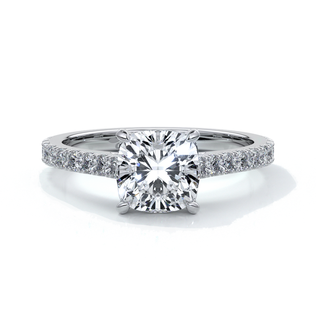 Platinum cathedral style band with a one and a half carat cushion cut diamond set in four claw platinum setting with shoulder diamonds