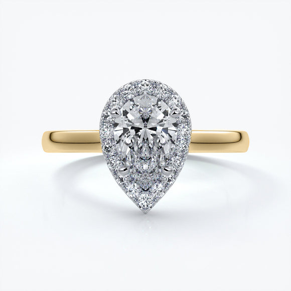 Gold ring with a one carat pear cut diamond in a cathedral halo setting with a slim comfort fit style band