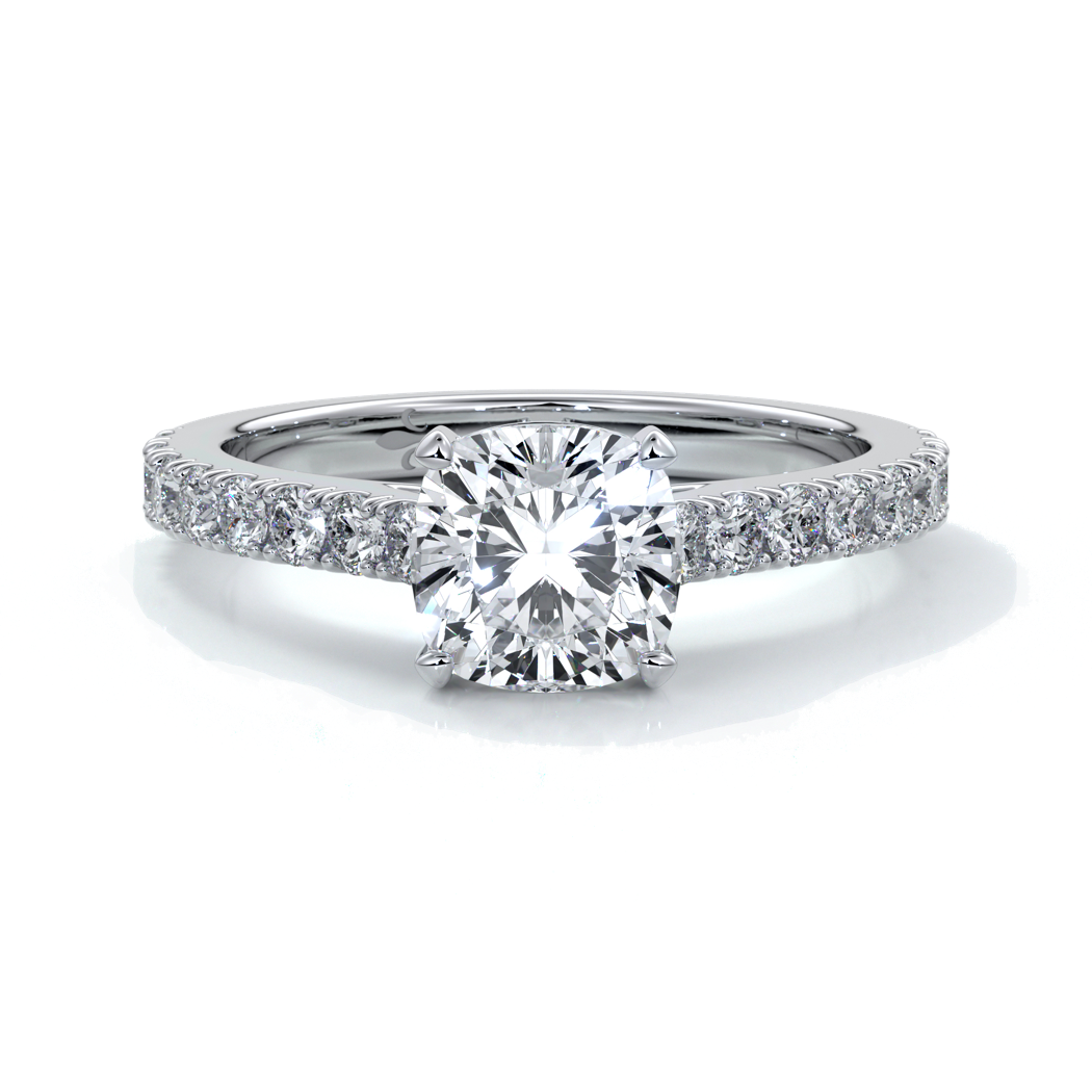Platinum diamond band ring with cushion cut diamond secured with four claws