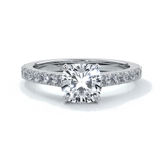 Platinum diamond band ring with cushion cut diamond secured with four claws