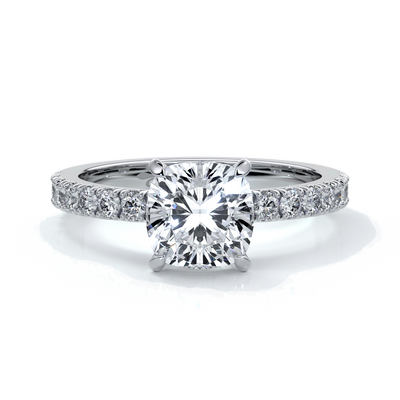 Platinum ring with cushion cut one and a half carat diamond secured with four claws and diamonds on the shoulder