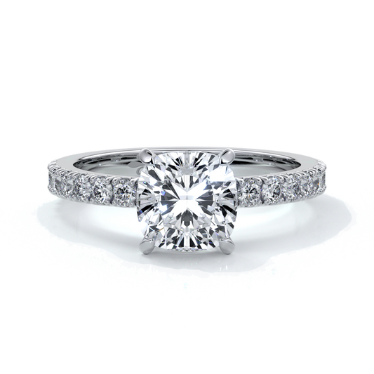 Platinum ring with cushion cut one and a half carat diamond secured with four claws and diamonds on the shoulder