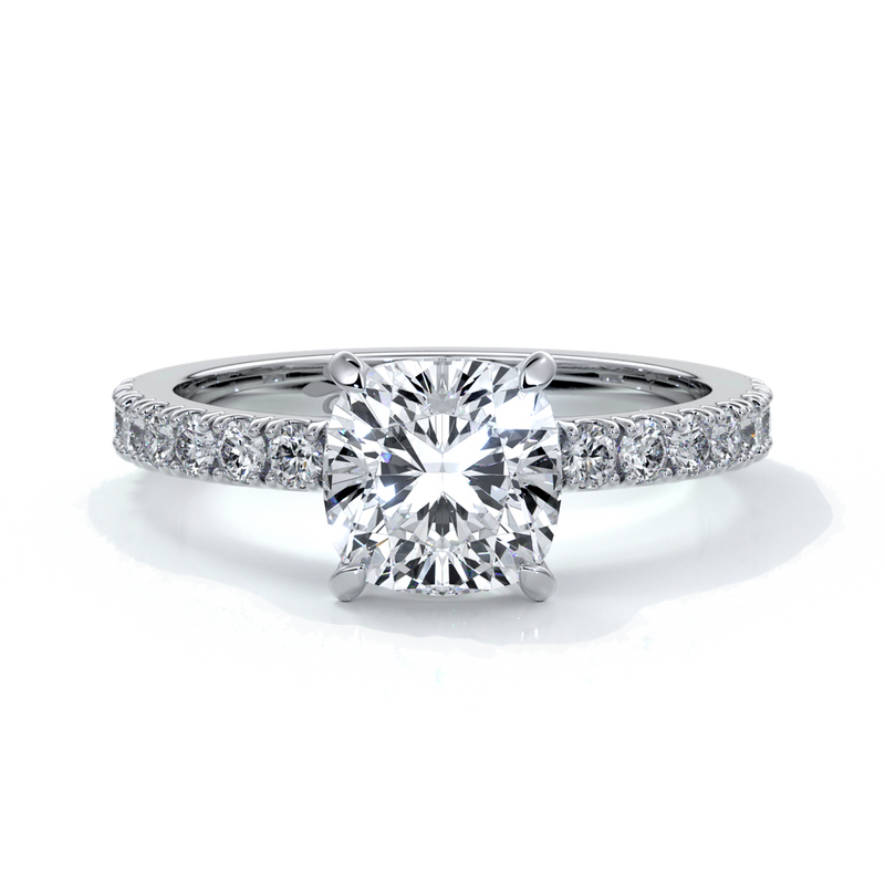 Platinum ring with cushion cut one and a half carat diamond secured with four claws and diamonds on the shoulder