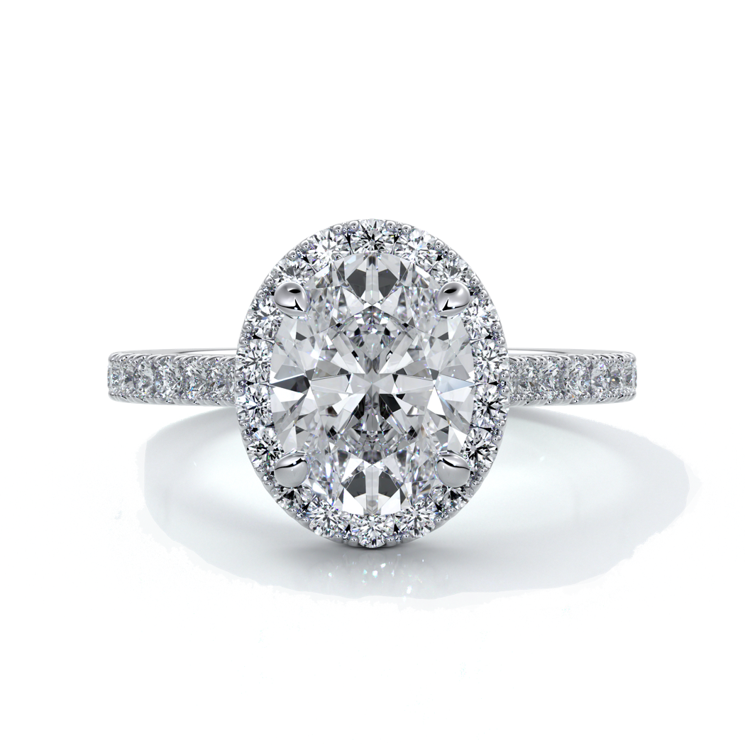 Platinum ring with a two carat oval cut diamond decorated with a scalloped set diamond halo